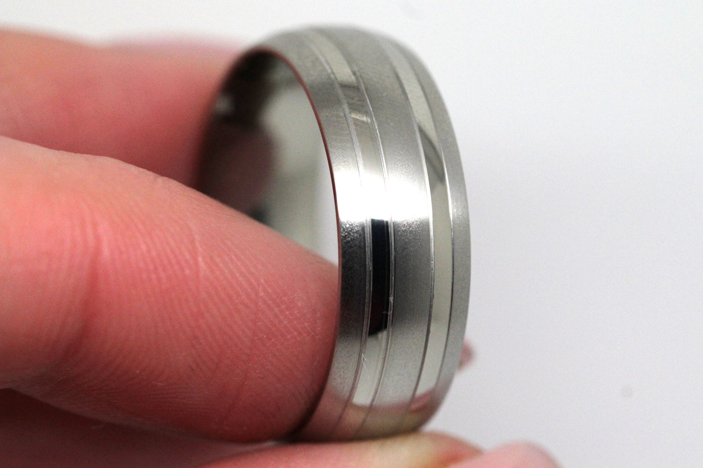 Brushed titanium wedding ring for men and women, featuring classic design and 8mm width