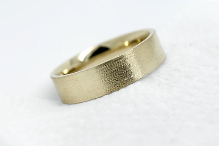 solid yellow gold wedding band for men and women with flat deep brush finish