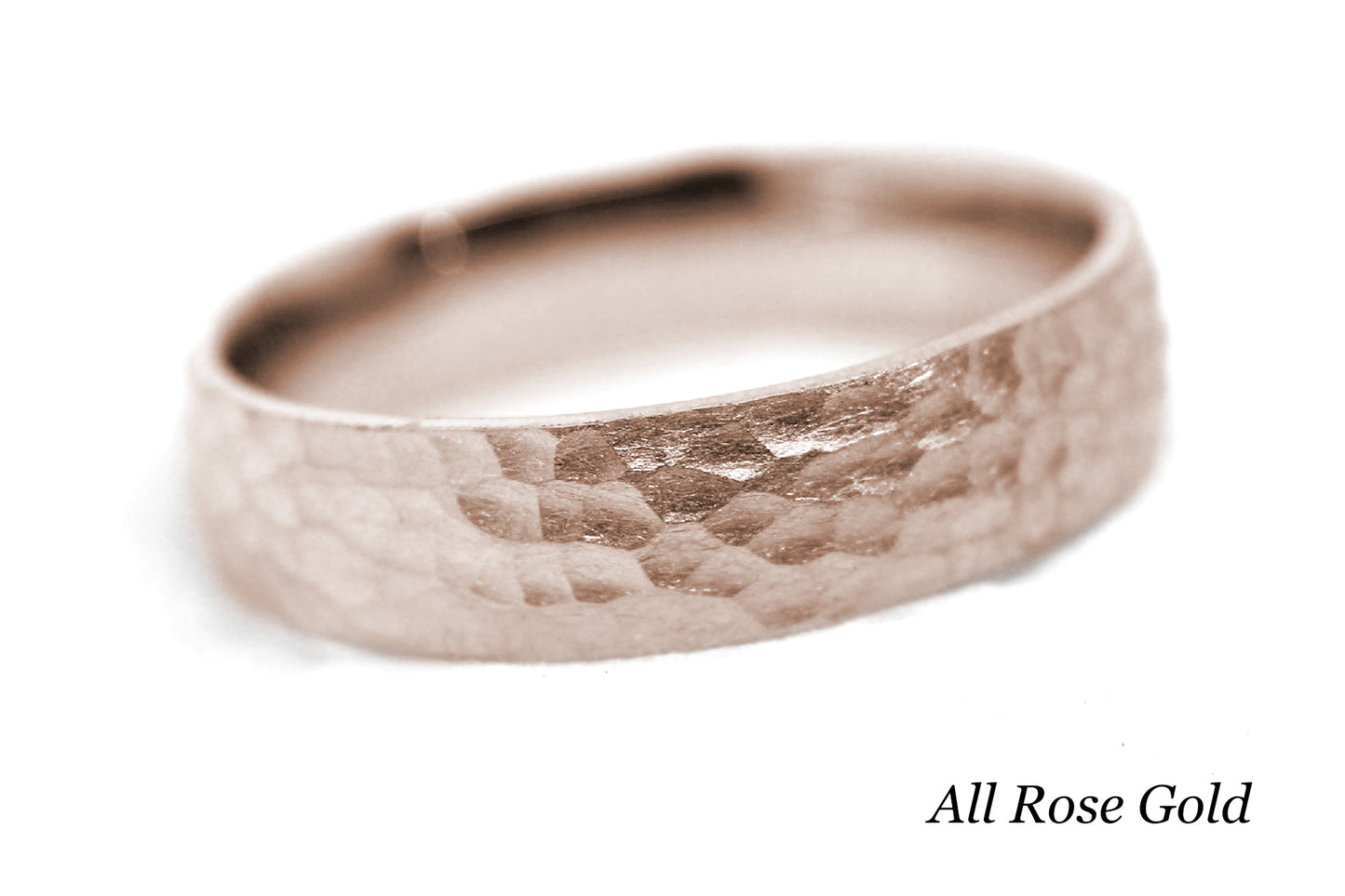 Rose gold ring with a textured surface on a white background.