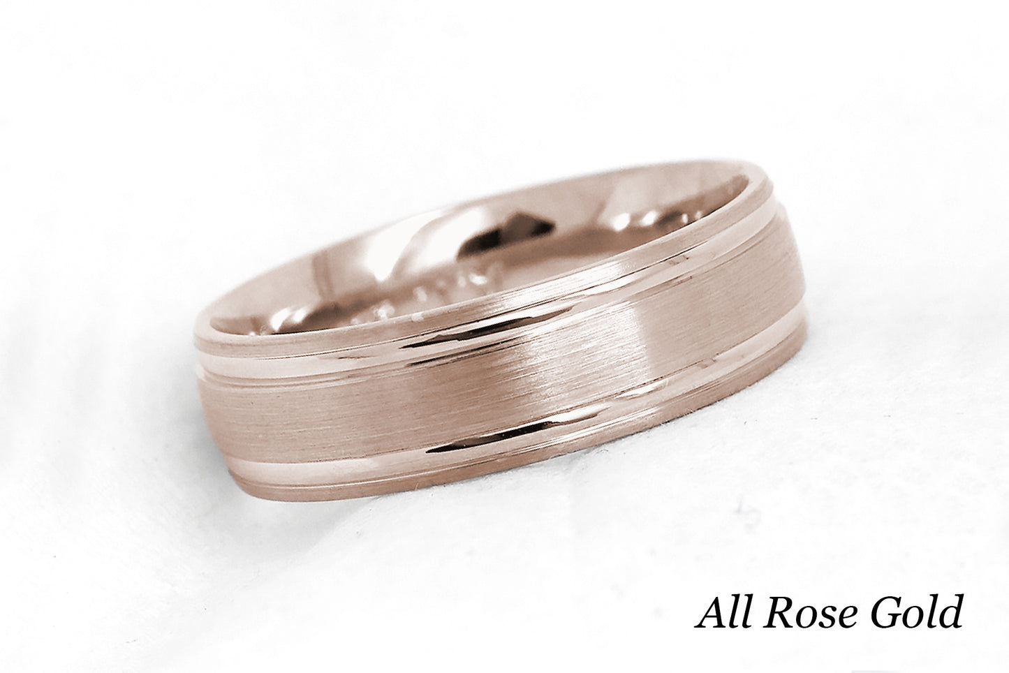 solid gold wedding band for men and women in rose gold. Brushed finish with polished lines.