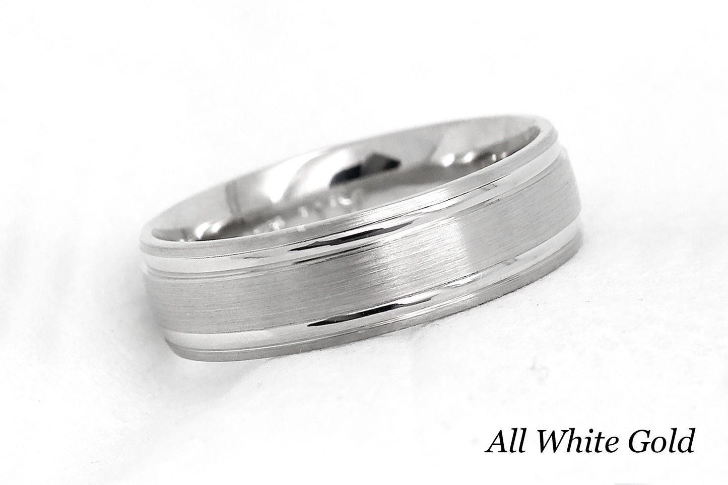 solid gold wedding band for men and women in white gold. Brushed finish with polished lines.
