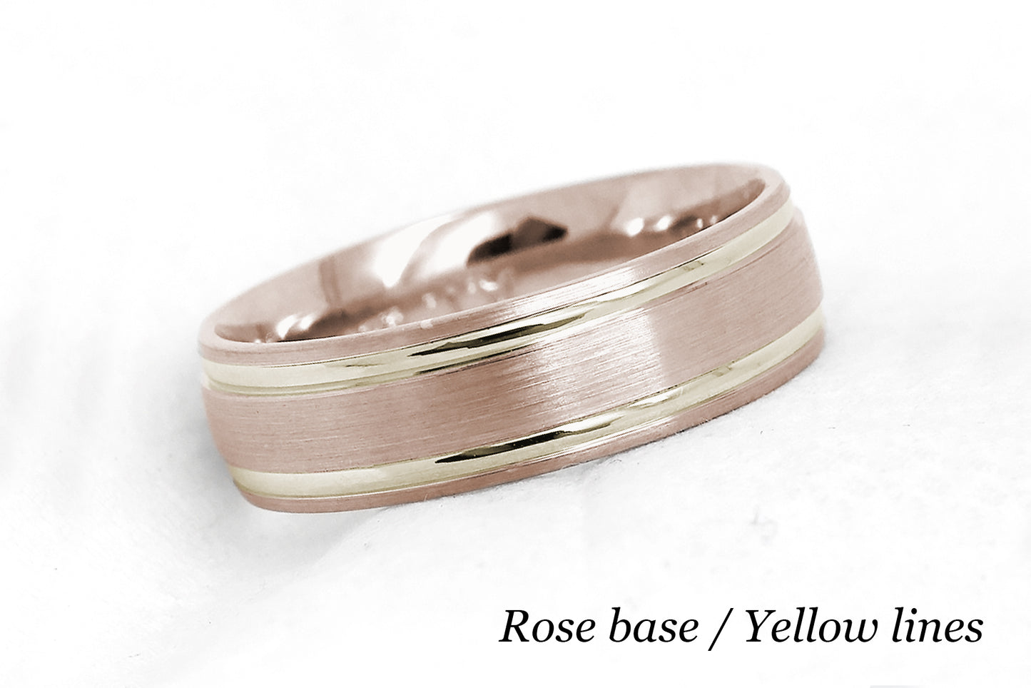 solid gold wedding band for men and women in rose gold base and yellow gold lines. Brushed finish with polished lines.