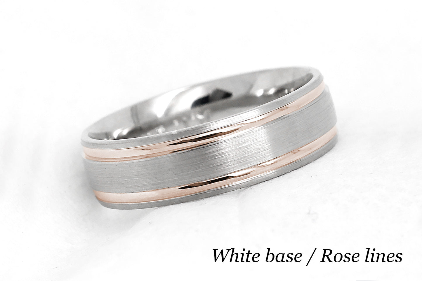 solid gold wedding band for men and women in white gold base and rose gold lines. Brushed finish with polished lines.