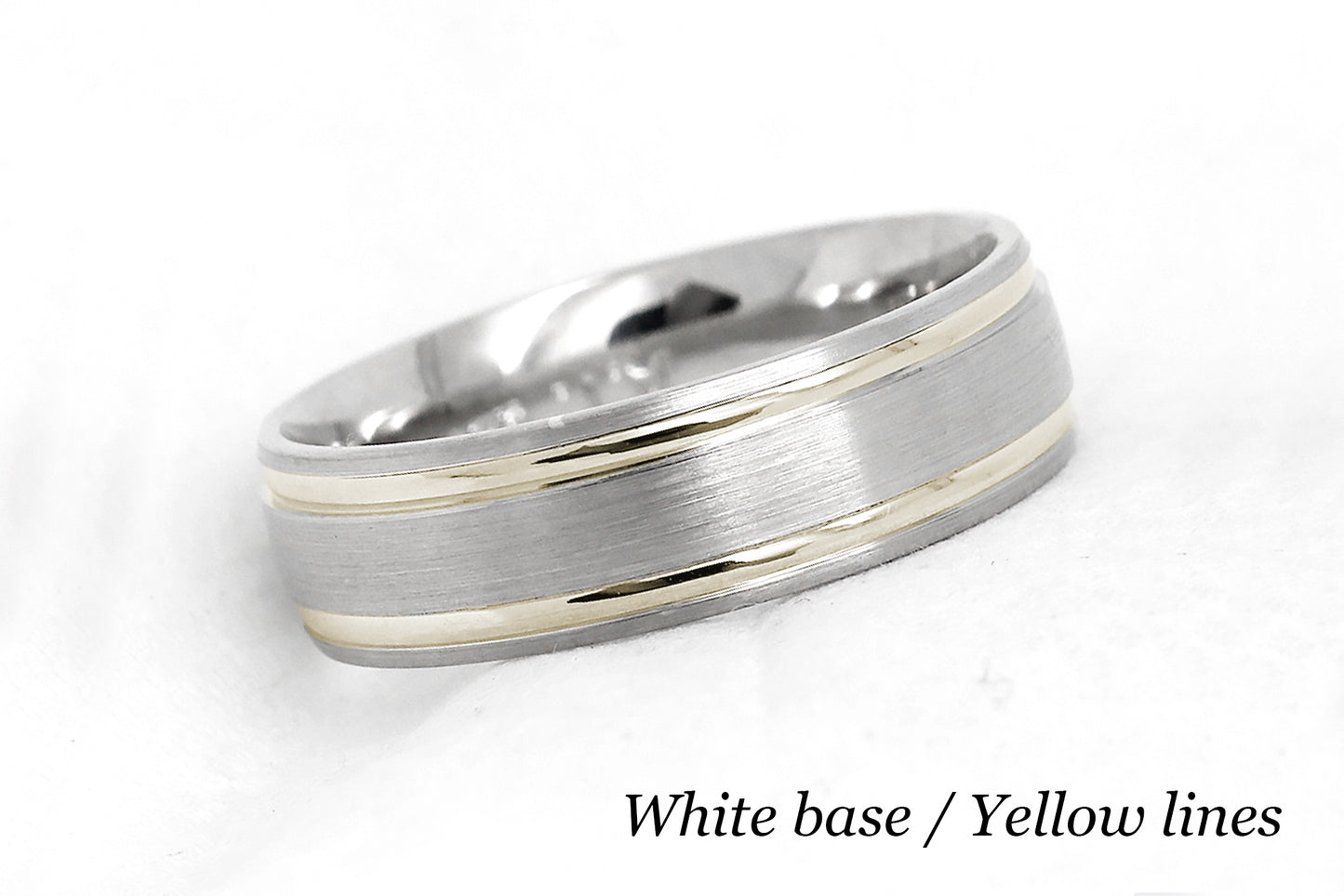 solid gold wedding band for men and women in white gold base and yellow gold lines. Brushed finish with polished lines.