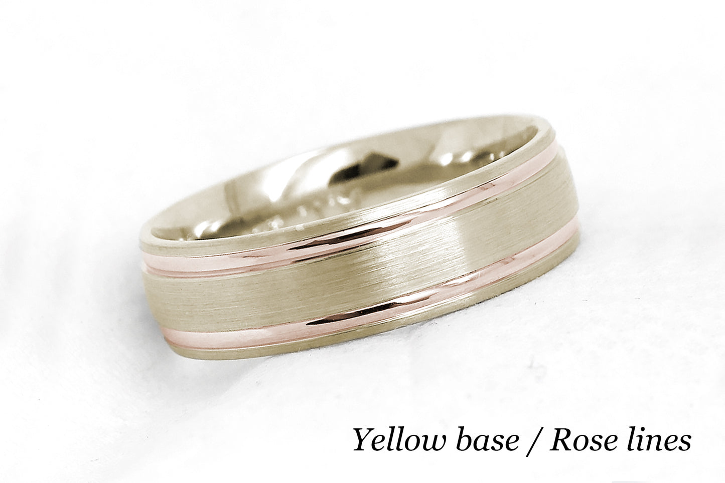 solid gold wedding band for men and women in yellow gold base and rose gold lines. Brushed finish with polished lines.