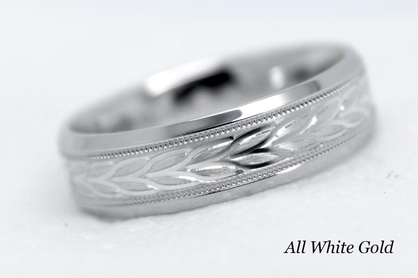 white gold beveled wedding band for men with beveled and floral brushed design