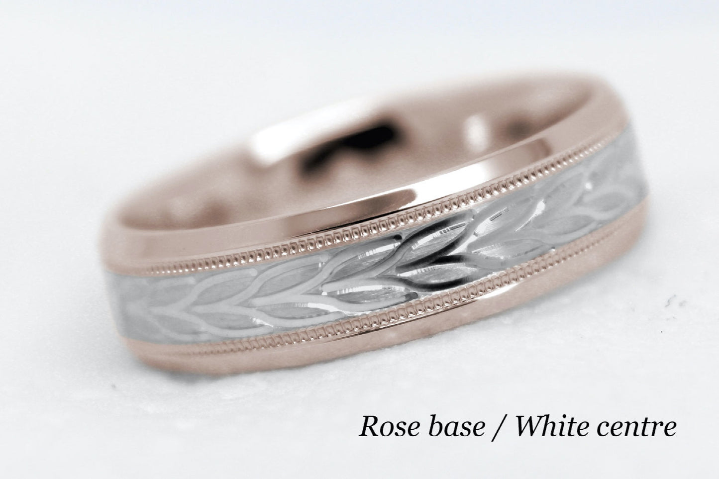 beveled wedding band for men with rose gold beveled base and white gold floral brushed design