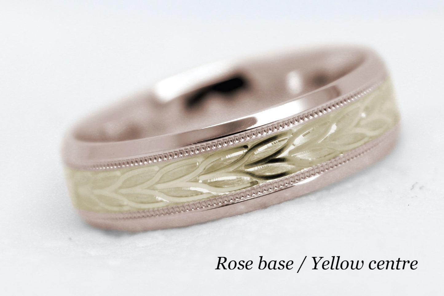 beveled wedding band for men with rose gold beveled base and yellow gold floral brushed design