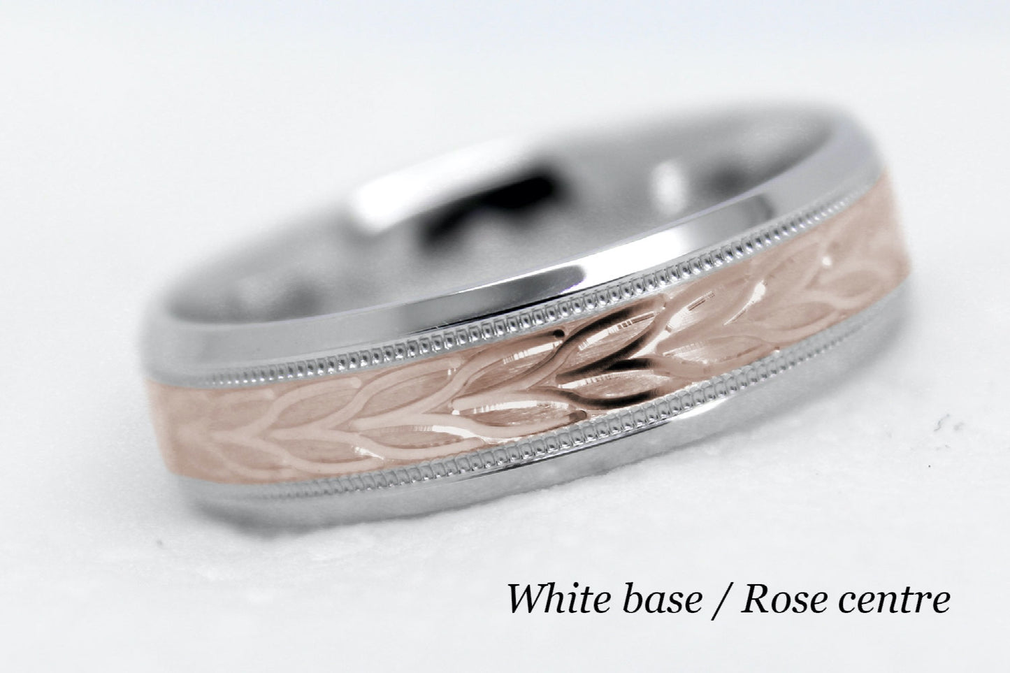 beveled wedding band for men with white gold beveled base and rose gold floral brushed design