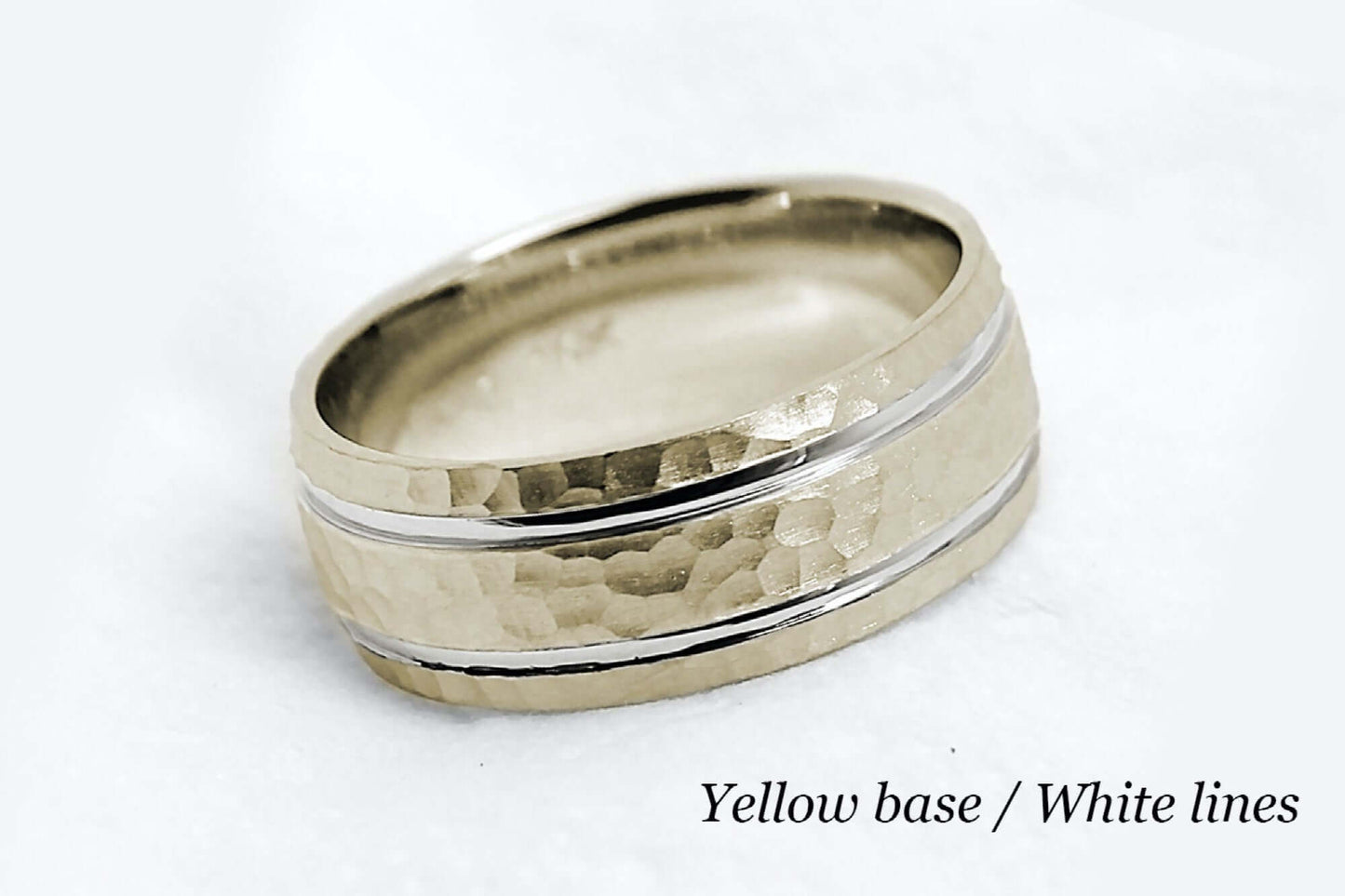 8mm wide Solid yellow gold ring for men featuring hammered finish and white gold polished lines. Low dome look with comfort fit.