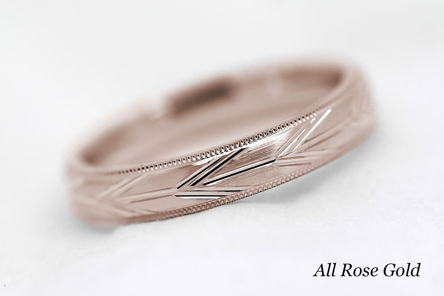 4mm solid gold wedding band in rose gold, featuring brushed centre with incut arrows design and milgrain edge, available in 10k gold 14k gold or 18k gold