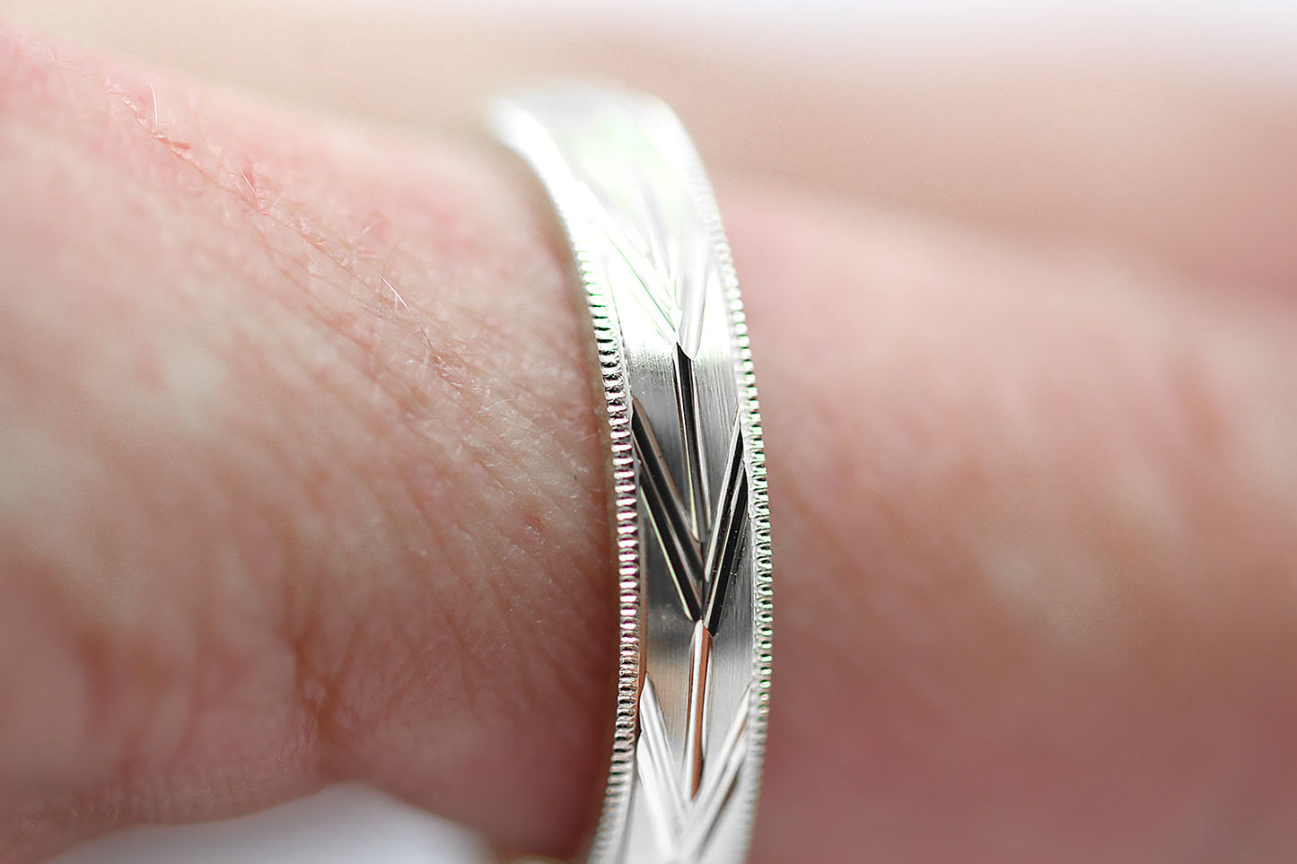 4mm solid 925 sterling silver wedding band, featuring brushed centre with incut arrows design and milgrain edge, the wedding band is with rhodium plating