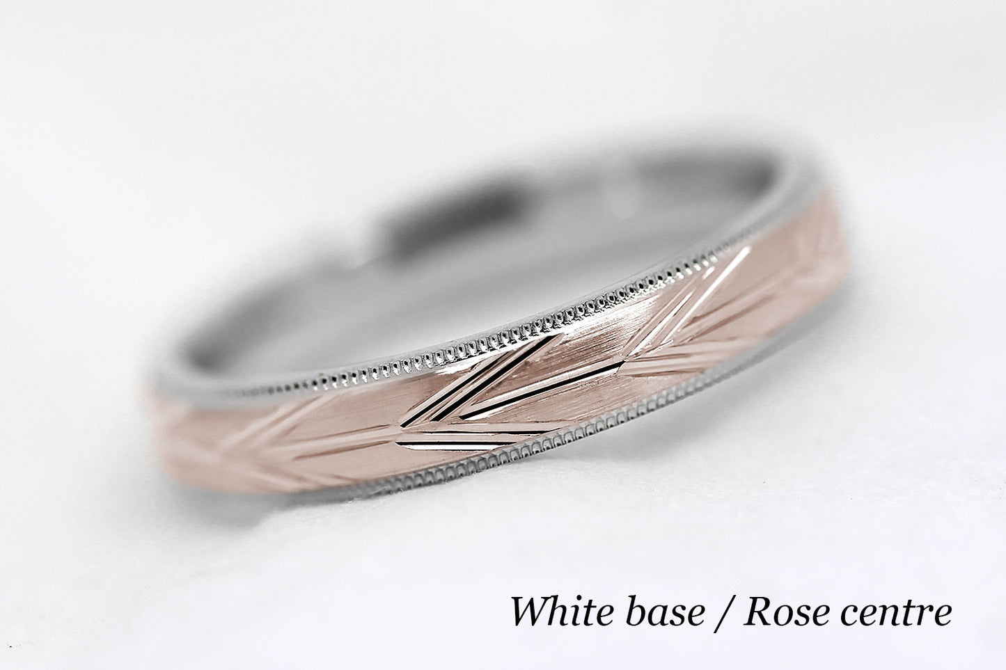 4mm solid gold wedding band with white gold base and rose gold centre, featuring brushed centre with incut arrows design and milgrain edge, available in 10k gold 14k gold or 18k gold