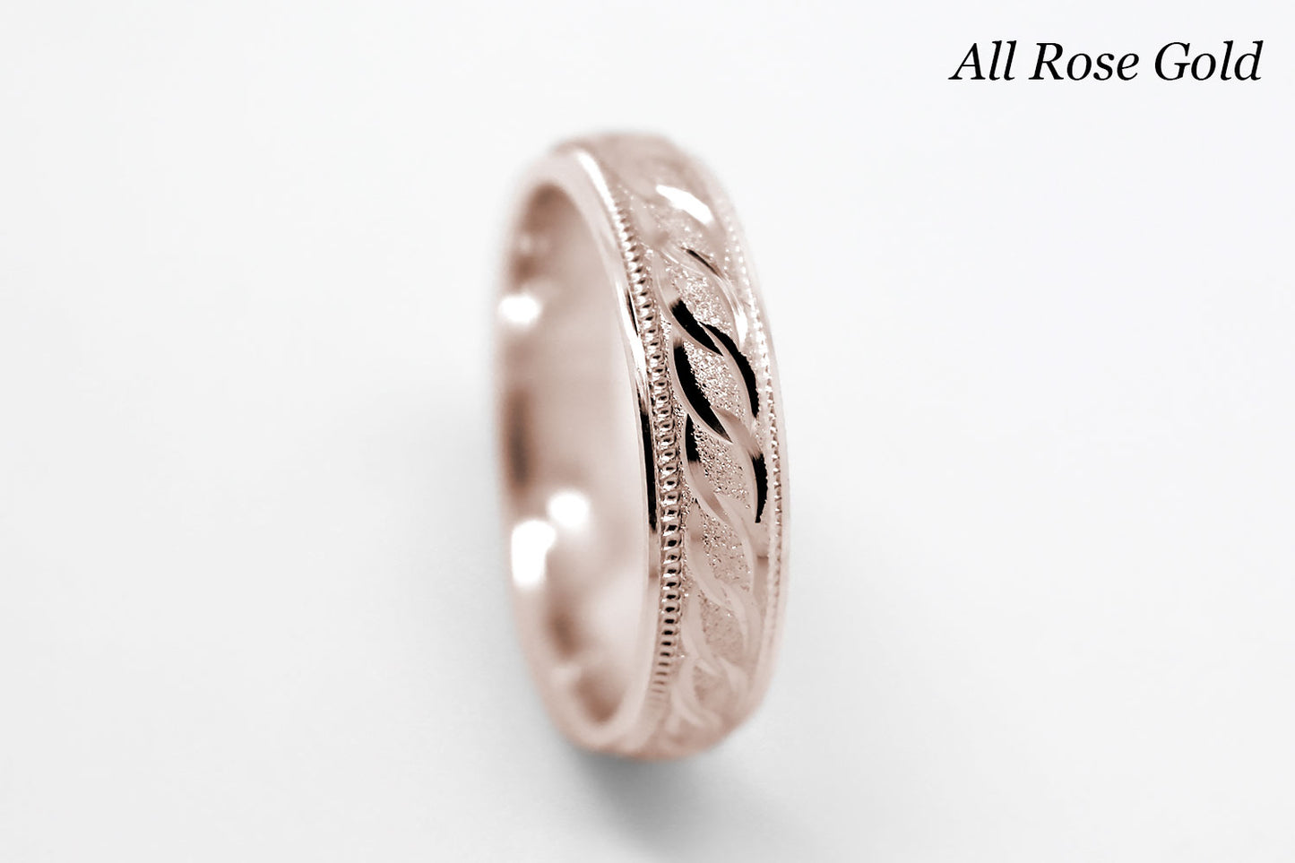 4mm solid gold wedding band in rose gold, featuring stone finish centre with incut moons design and milgrain edge, available in 10k gold 14k gold and 18k gold