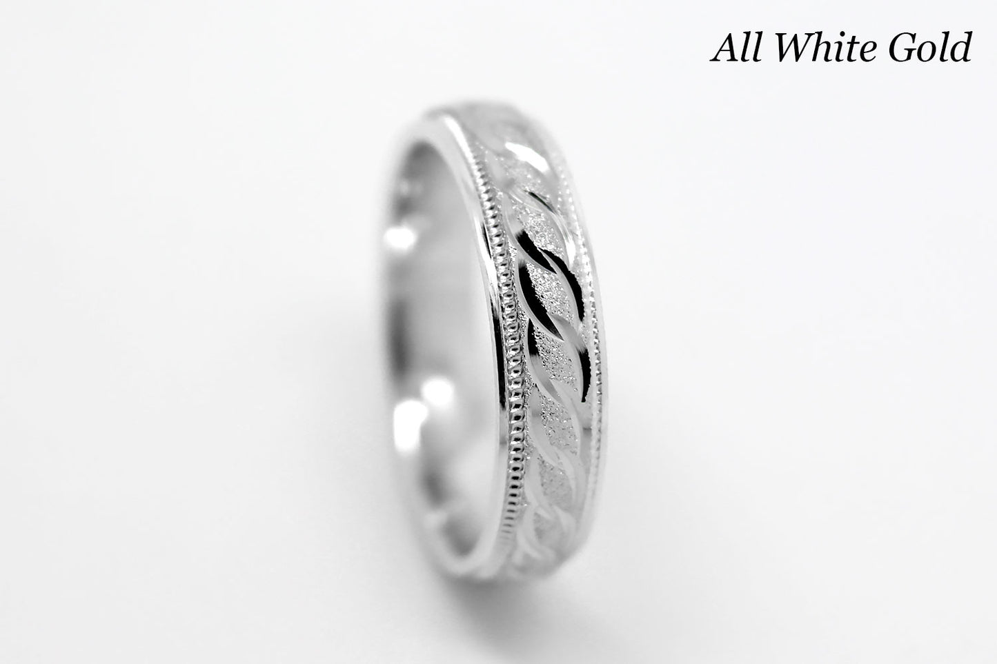 4mm solid gold wedding band in white gold, featuring stone finish centre with incut moons design and milgrain edge, available in 10k gold 14k gold and 18k gold