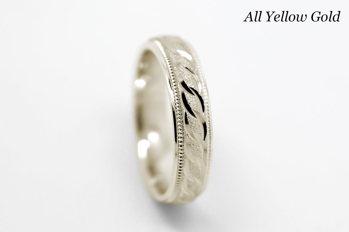 4mm solid gold wedding band in yellow gold, featuring stone finish centre with incut moons design and milgrain edge, available in 10k gold 14k gold and 18k gold