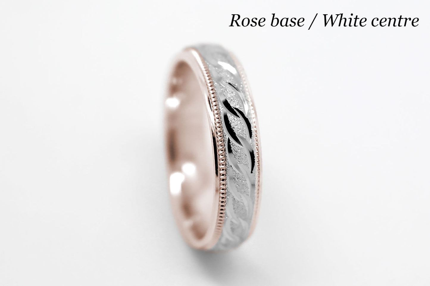 4mm solid gold wedding band with rose gold base and white gold, featuring stone finish centre with incut moons design and milgrain edge, available in 10k gold 14k gold and 18k gold