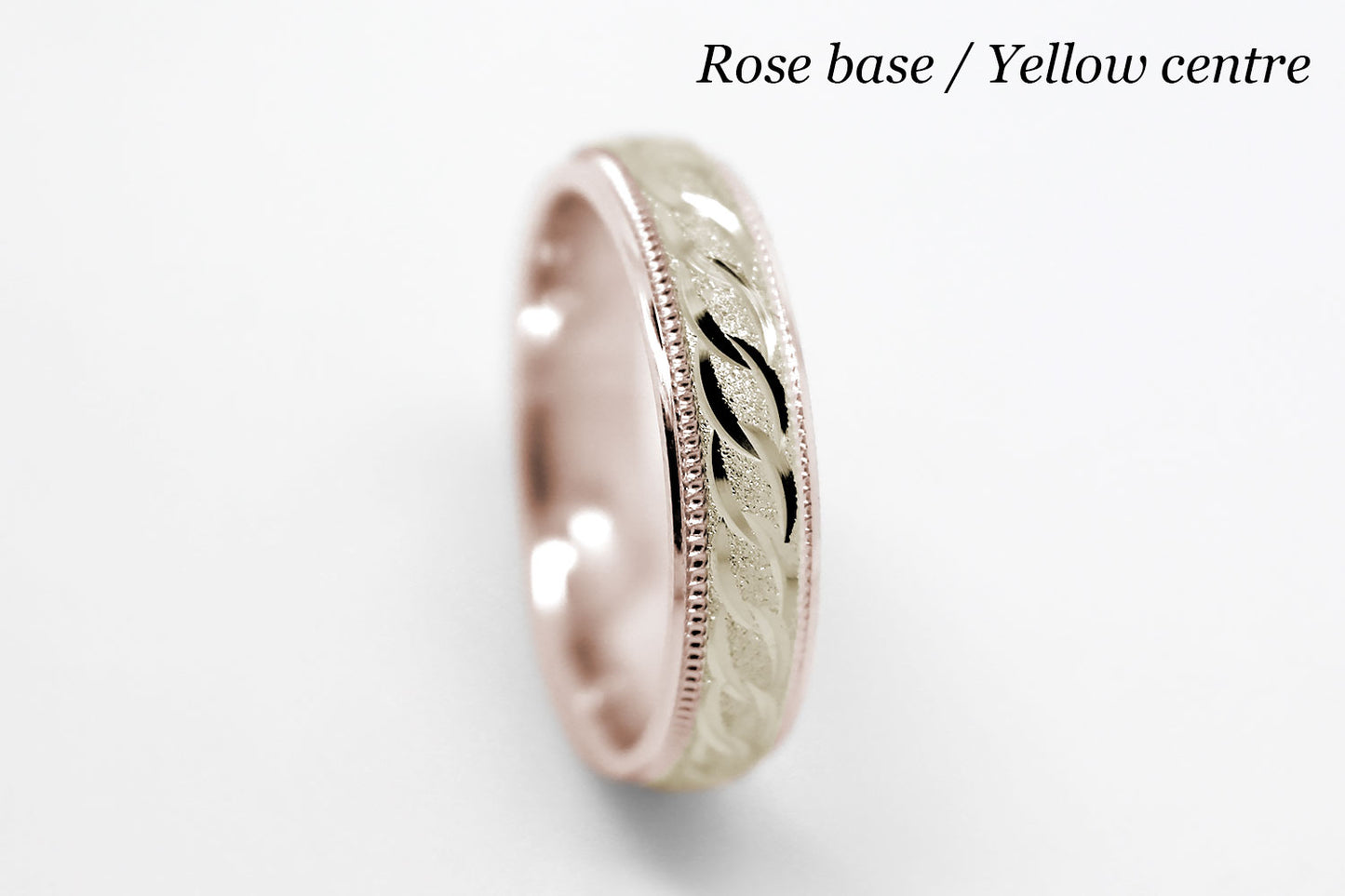 4mm solid gold wedding band with rose gold base and yellow gold, featuring stone finish centre with incut moons design and milgrain edge, available in 10k gold 14k gold and 18k gold
