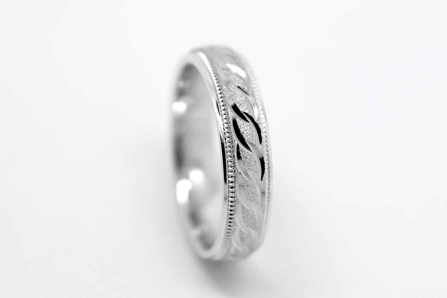 4mm solid 925 sterling silver wedding band in white gold, featuring stone finish centre with incut moons design and milgrain edge