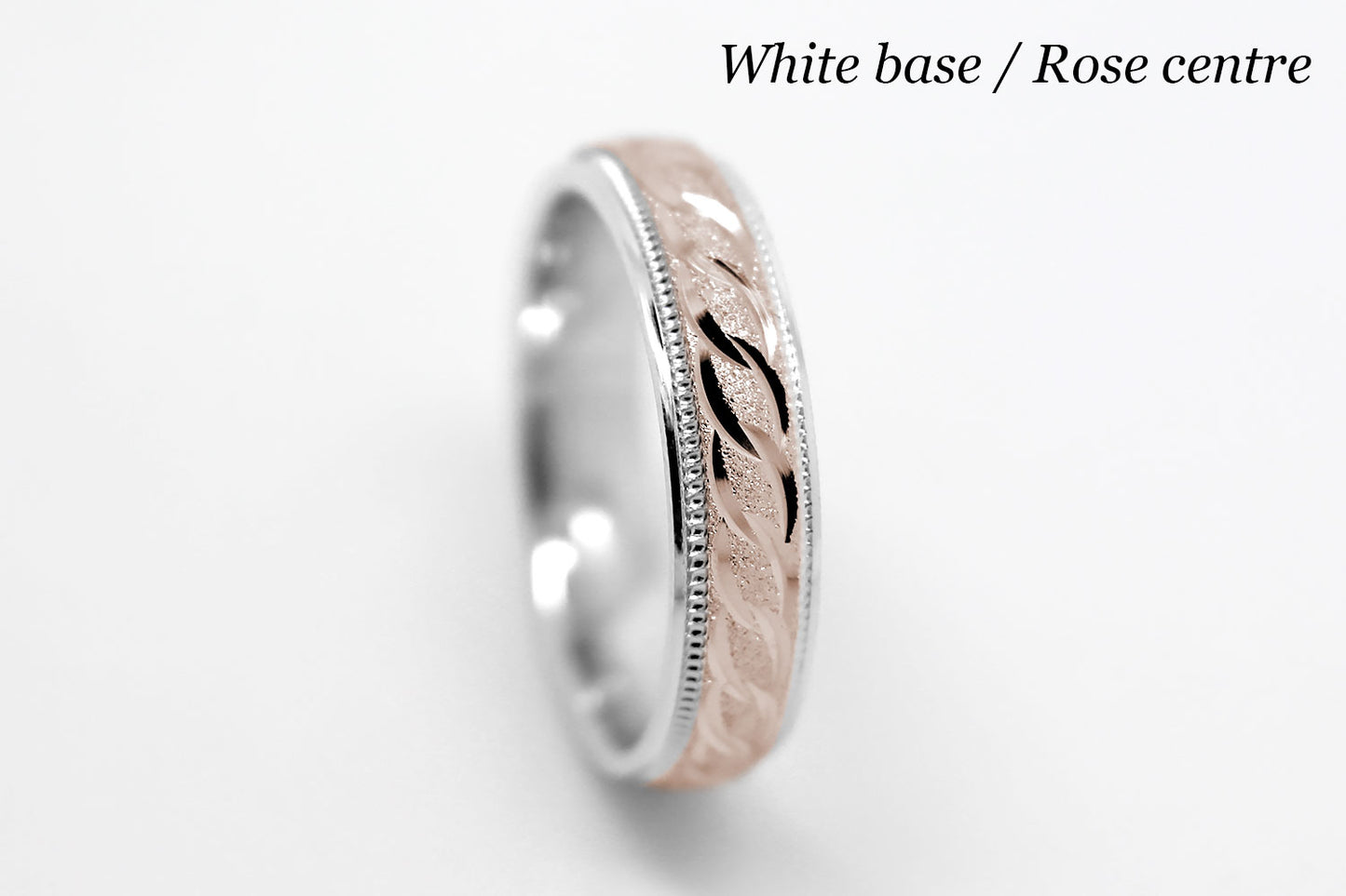 4mm solid gold wedding band with White gold base and rose gold, featuring stone finish centre with incut moons design and milgrain edge, available in 10k gold 14k gold and 18k gold
