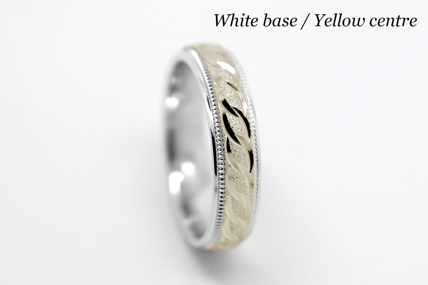 4mm solid gold wedding band with white gold base and yellow gold, featuring stone finish centre with incut moons design and milgrain edge, available in 10k gold 14k gold and 18k gold
