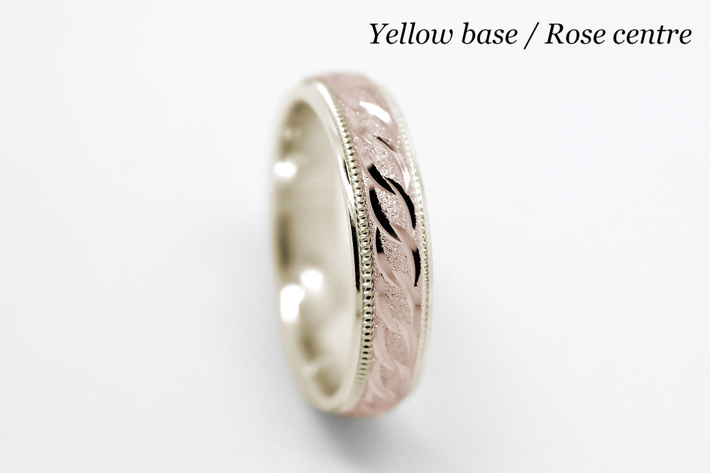 4mm solid gold wedding band with yellow gold base and rose gold, featuring stone finish centre with incut moons design and milgrain edge, available in 10k gold 14k gold and 18k gold