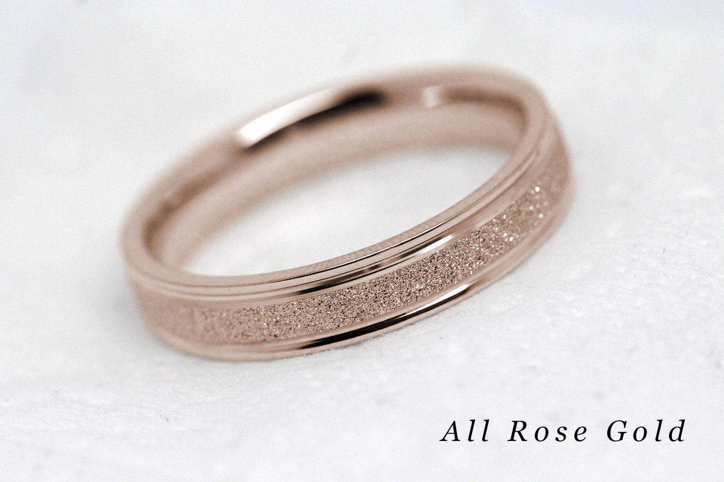 4mm solid gold wedding band for women and men with sparkly rose gold centre and polished rose gold base and edges, available in 10 karat 14 karat or 18 karat gold