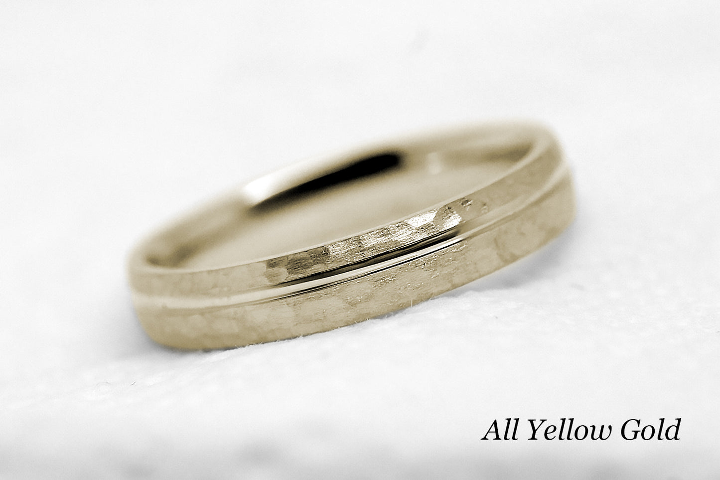 4mm 10 karat 14 karat or 18 karat solid gold hammered wedding band in yellow gold with off centre yellow gold polished line