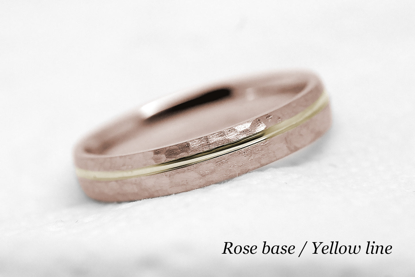 4mm 10 karat 14 karat or 18 karat solid gold hammered wedding band in rose gold with off centre yellow gold polished line