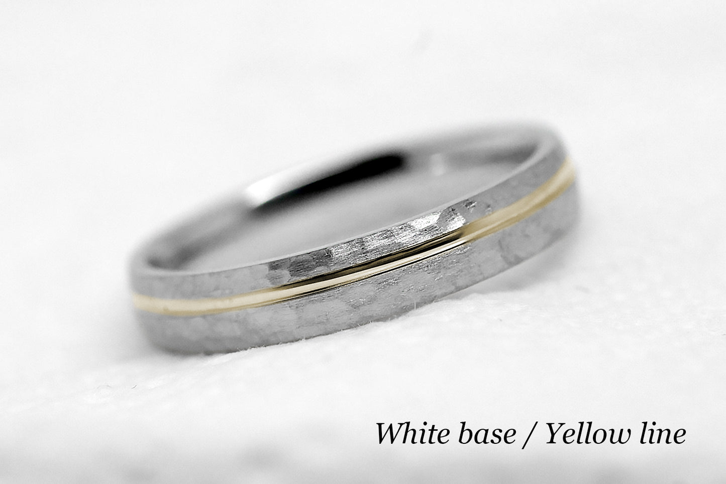 4mm 10 karat 14 karat or 18 karat solid gold hammered wedding band in white gold with off centre yellow gold polished line