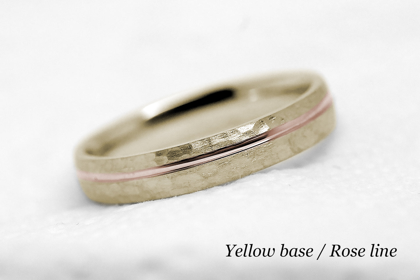 4mm 10 karat 14 karat or 18 karat solid gold hammered wedding band in yellow gold with off centre rose gold polished line