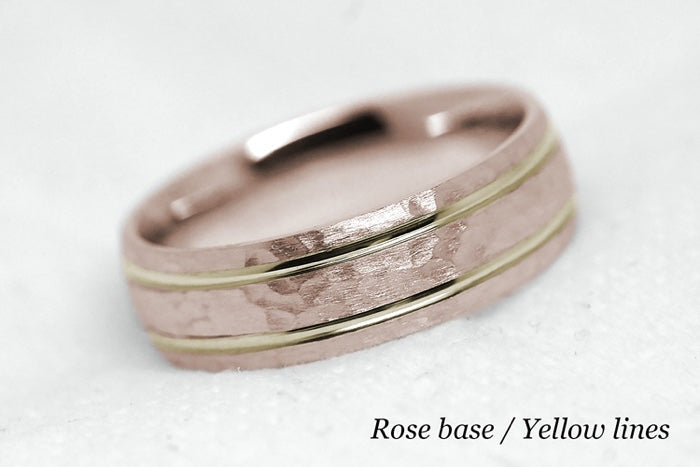 Solid gold hammered wedding ring for men and women with polished lines. Handcrafted in rose gold base and yellow gold lines