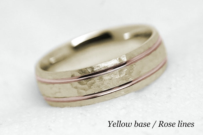 Solid gold hammered wedding ring for men and women with polished lines. Handcrafted in yellow gold base and rose gold lines
