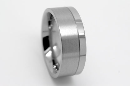 Flat Titanium ring on a light gray background