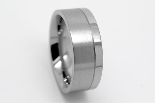 Flat Titanium ring on a light gray background