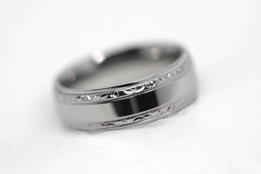 Polished 6mm titanium wedding ring for men and women with filigree edge, perfect for anniversaries and engagements.