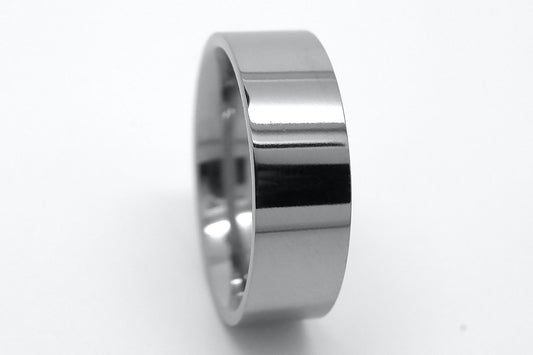 Polished Titanium ring on a white background
