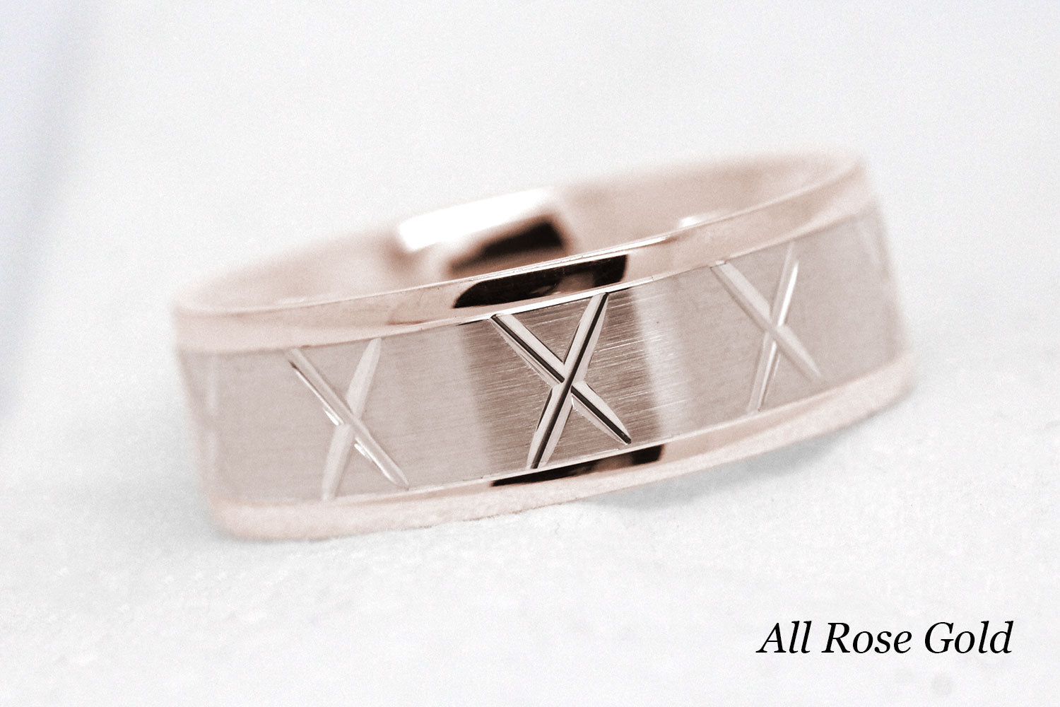 gold wedding band for men in brushed finish centre. X design around the entire ring in rose Gold 