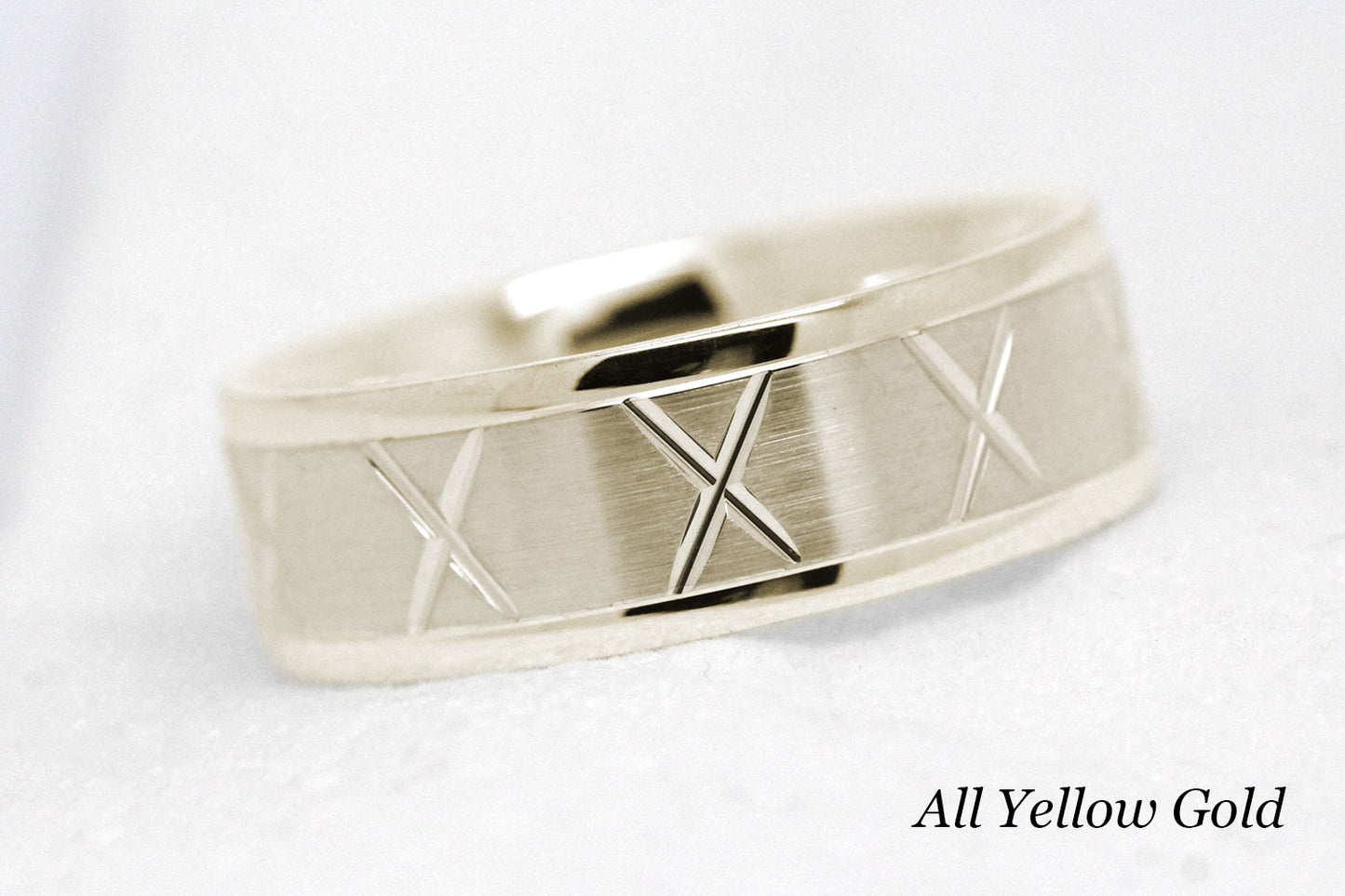 gold wedding band for men in brushed finish centre. X design around the entire ring in yellow Gold 