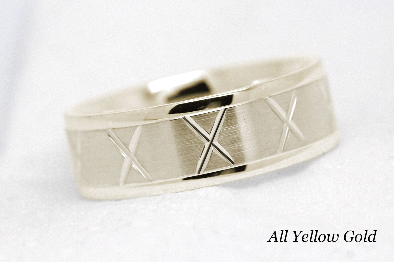 gold wedding band for men in brushed finish centre. X design around the entire ring in yellow Gold 