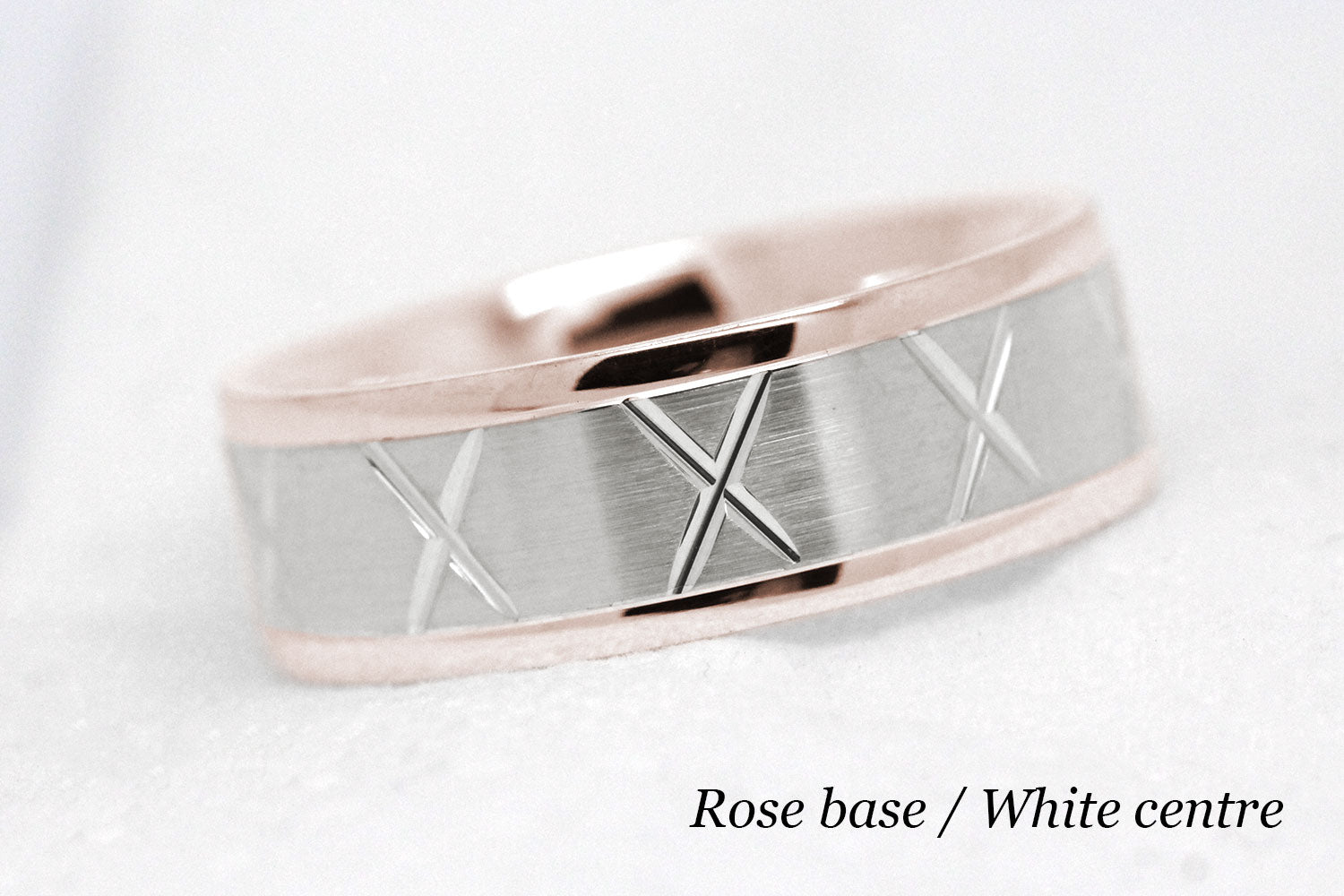 gold wedding band for men in brushed finish centre. X design around the entire ring . rose Gold base and white gold centre