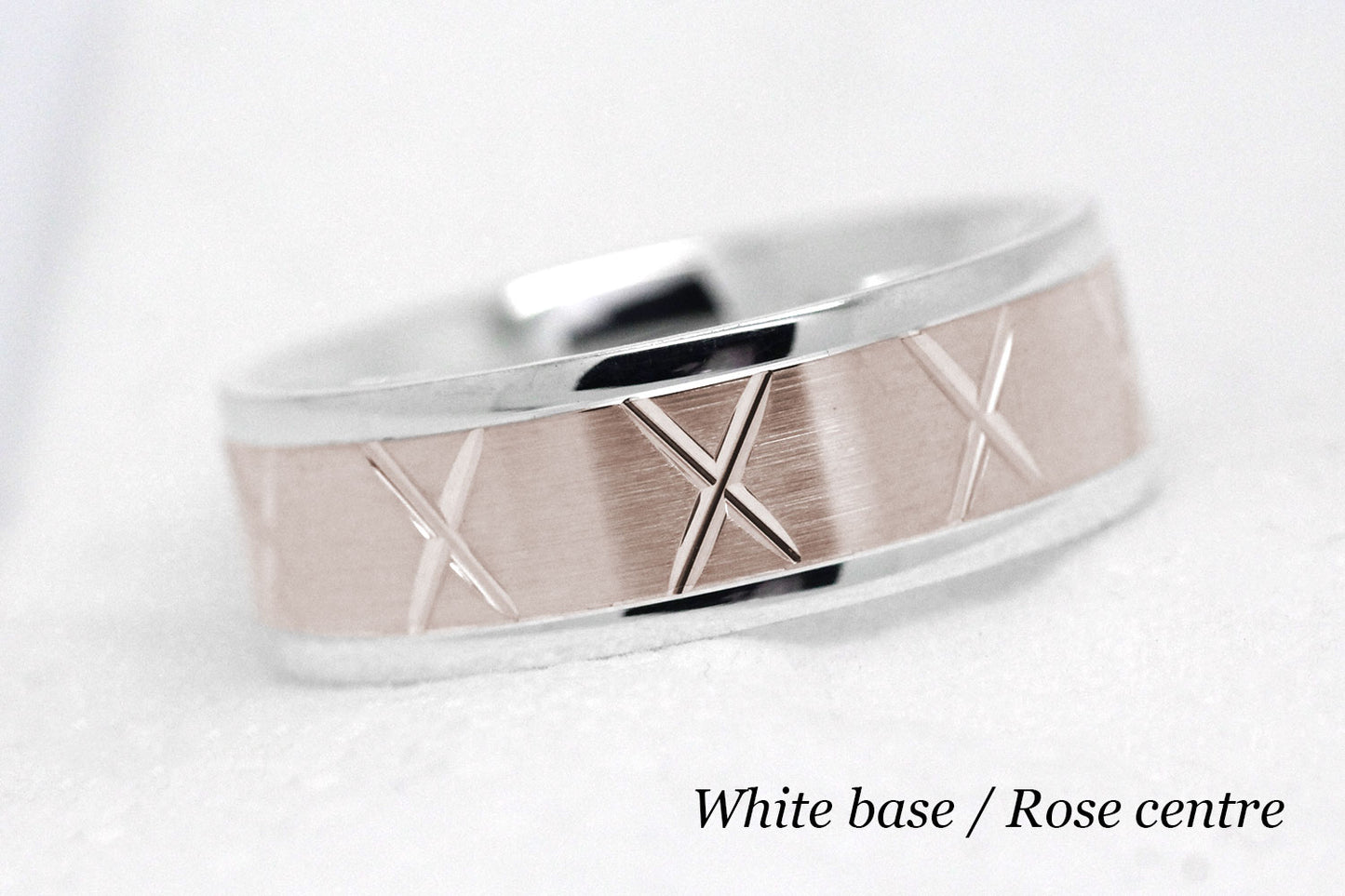 gold wedding band for men in brushed finish centre. X design around the entire ring . White Gold base and rose gold centre