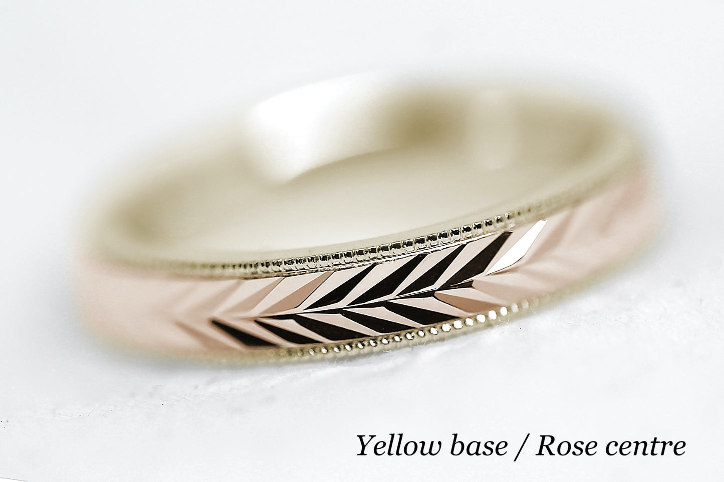 solid gold wedding band for men and women. Wheat Design, faceted and reflective centre is handcrafted in Montreal. yellow Gold base and rose gold centre in solid 10k 14k or 18k gold