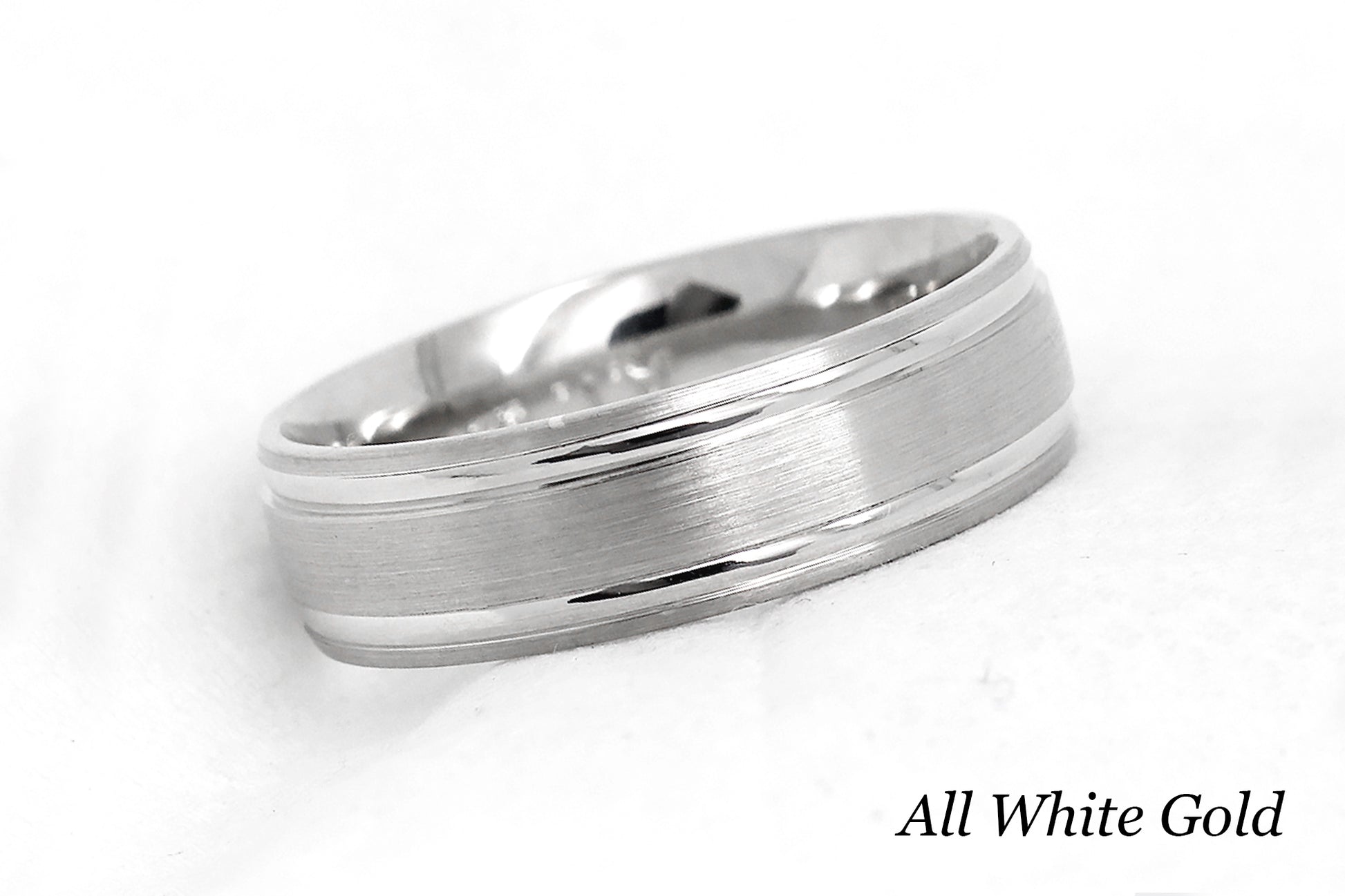 solid gold wedding band for men and women in white gold. Brushed finish with polished lines.