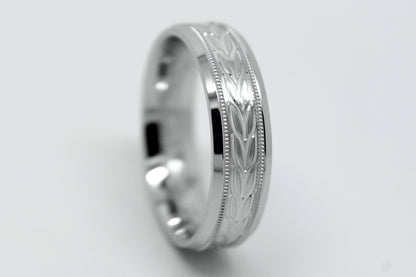 white gold beveled wedding band for men with beveled and  floral brushed design