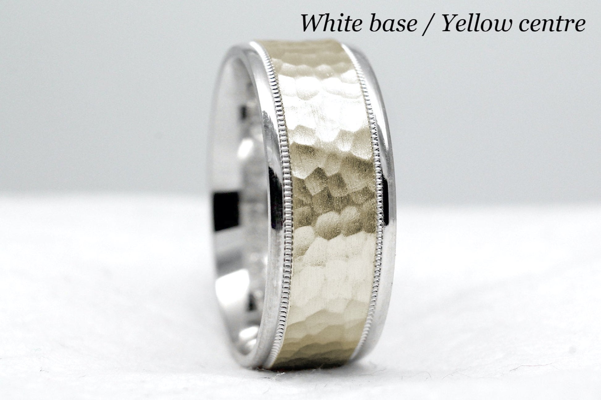 White gold base and yellow gold centre. 8mm hammered wedding band for men and women