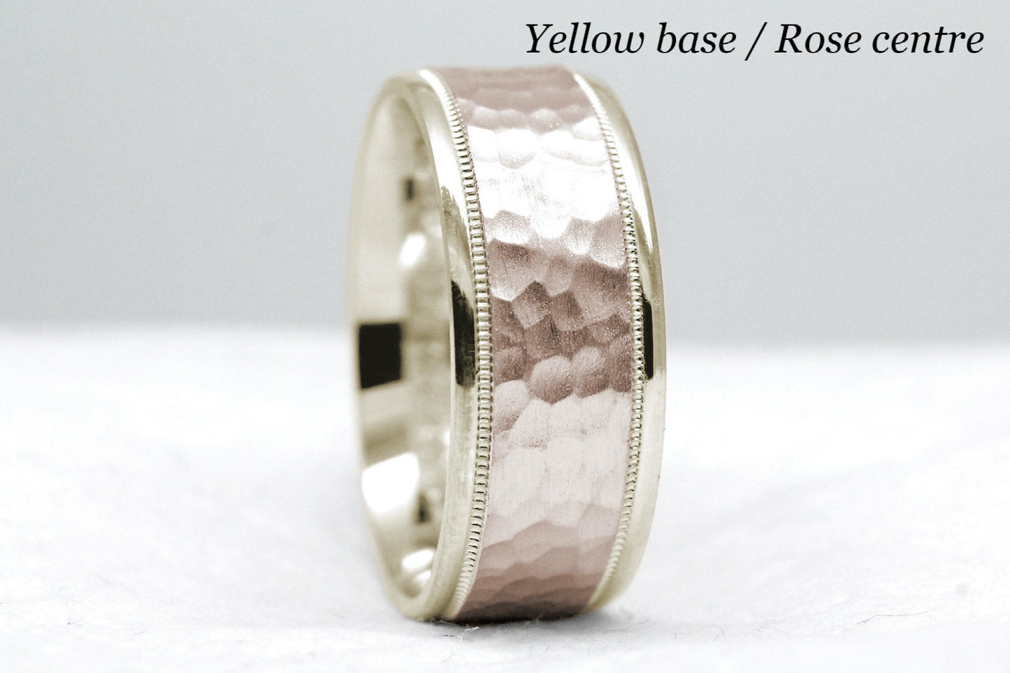 yellow gold base and rose gold centre. 8mm hammered wedding band for men and women