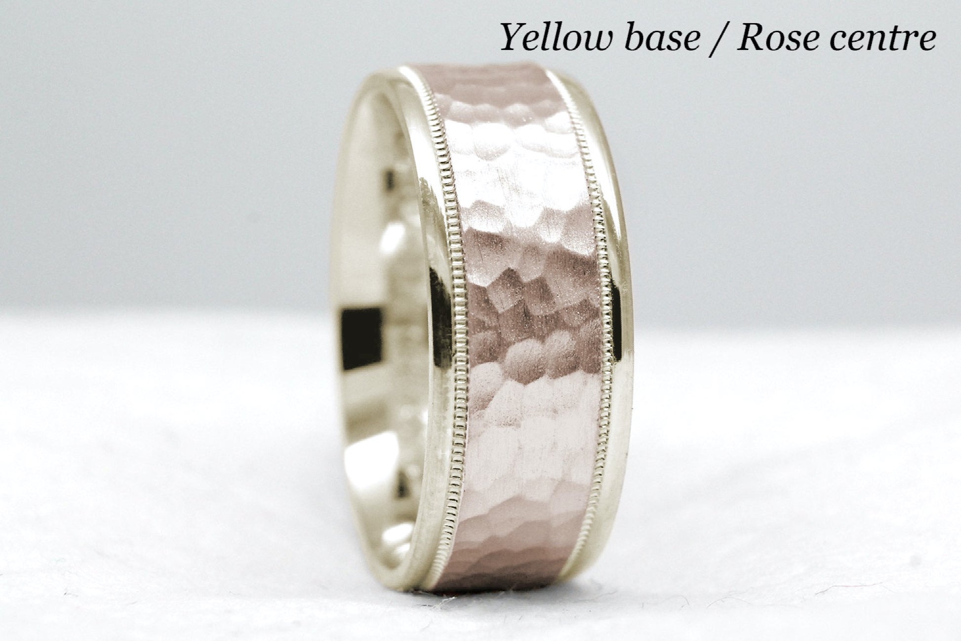yellow gold base and rose gold centre. 8mm hammered wedding band for men and women