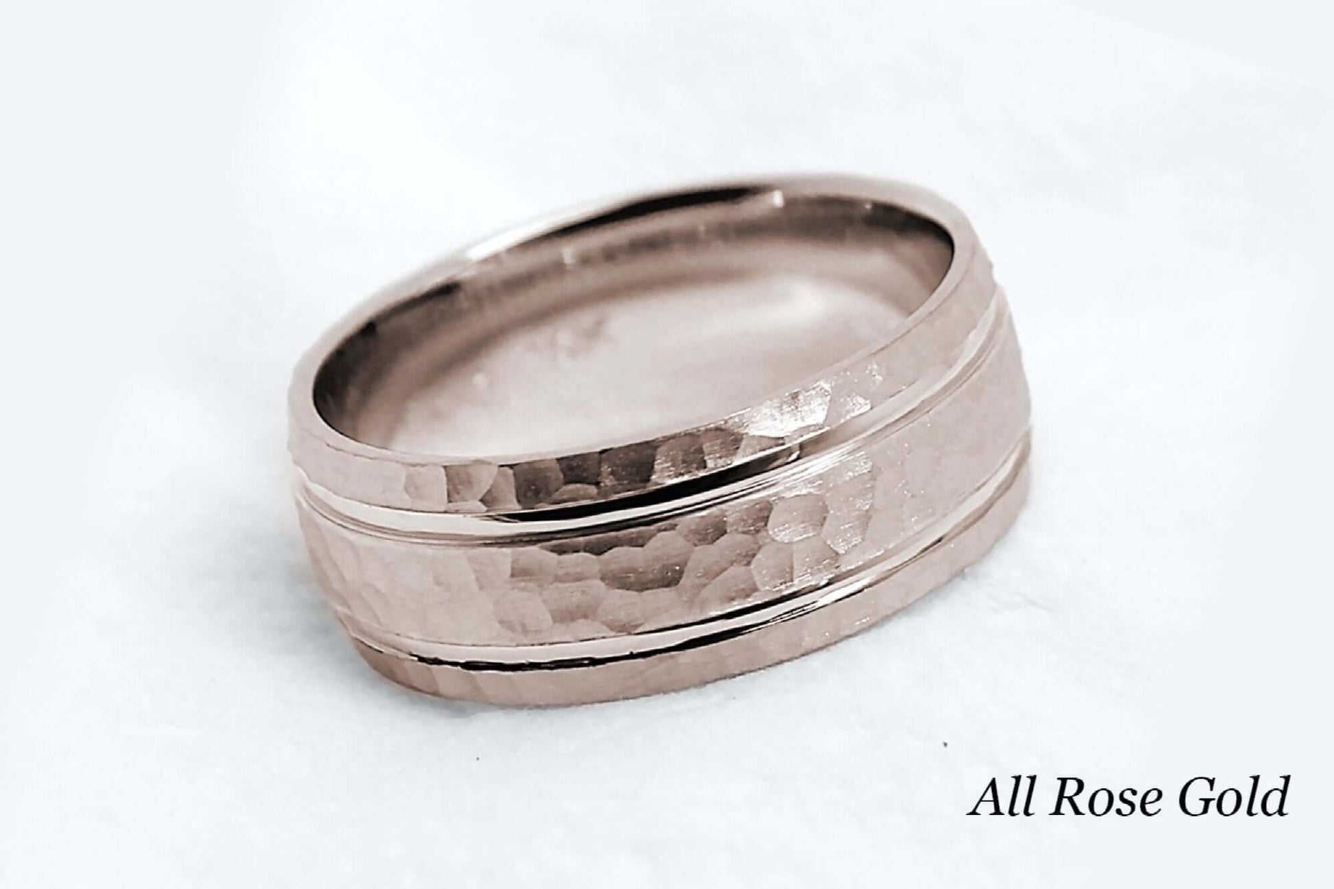 8mm wide Solid rose gold ring for men featuring hammered finish and polished lines. Low dome look with comfort fit.