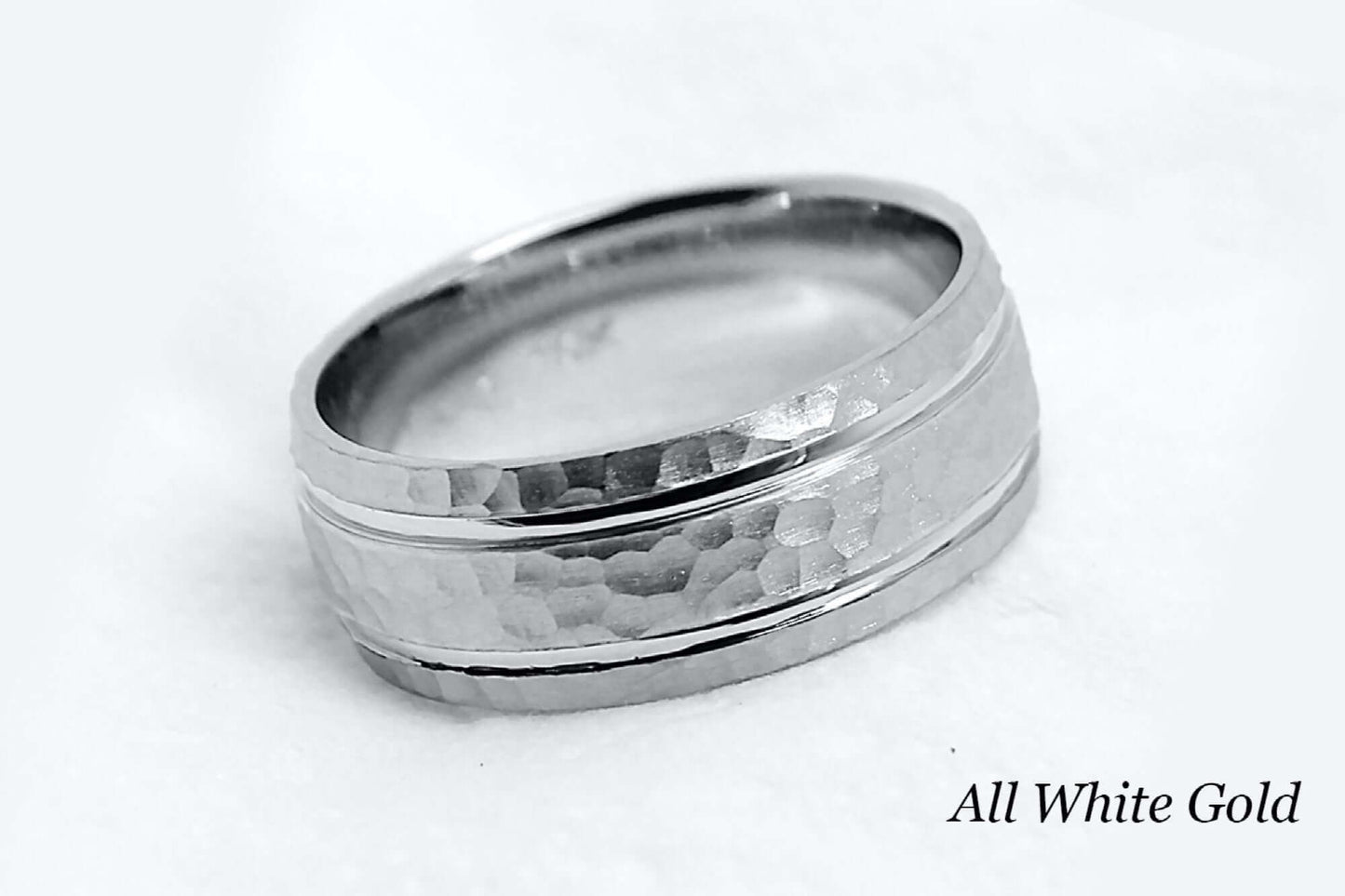 8mm wide Solid white gold ring for men featuring hammered finish and polished lines. Low dome look with comfort fit.
